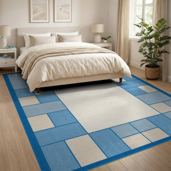 Blue and Teal Blue Geometric Border Area Rug