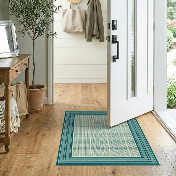 Blue and Teal Geometric Bordered Area Rug