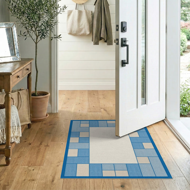 Blue and Teal Blue Geometric Border Area Rug