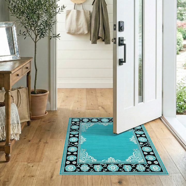 Teal Floral Vintage Area Rug with Black Border