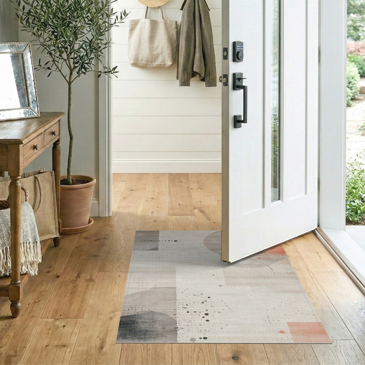 Abstract Beige Area Rug with Orange Accents
