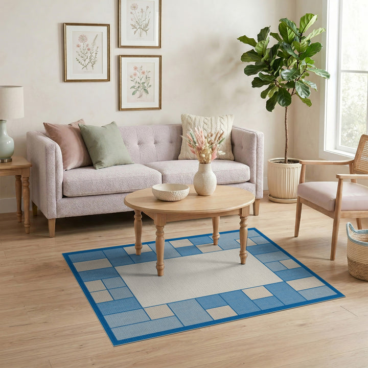 Blue and Teal Blue Geometric Border Area Rug